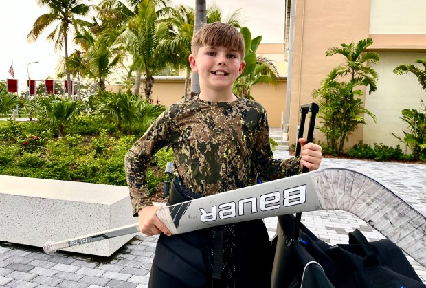 Greyson Raymond, 11, of Fort Lauderdale, was inspired by the Florida Panthers' Stanley Cup win to learn to play hockey like his favorite Florida Panther, goalie Sergei Bobrovsky, at the Baptist Health IcePlex in downtown Fort Lauderdale. (Ben Crandell/South Florida Sun Sentinel)