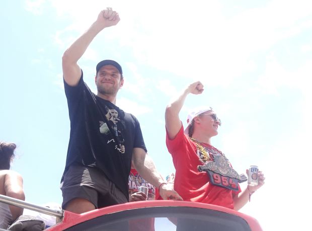 Florida Panthers’ Aleksander Barkov and Anton Lundell cheer with fans...