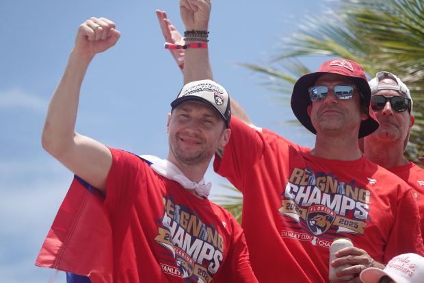 Florida Panthers’ Sergei Bobrovsky greets fans along the route of...