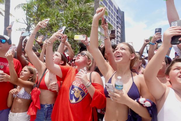Fans cheer on the Florida Panthers as they pass by...