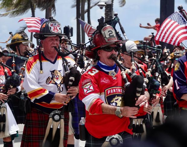 Fans cheer on the Florida Panthers as they pass by...