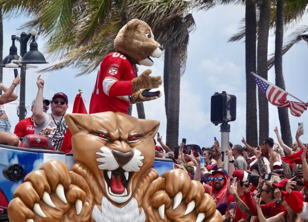 Fans cheer on the Florida Panthers as they pass by...