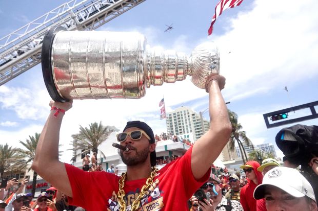 Seth Jones of the Florida Panthers raises the Stanley Cup...