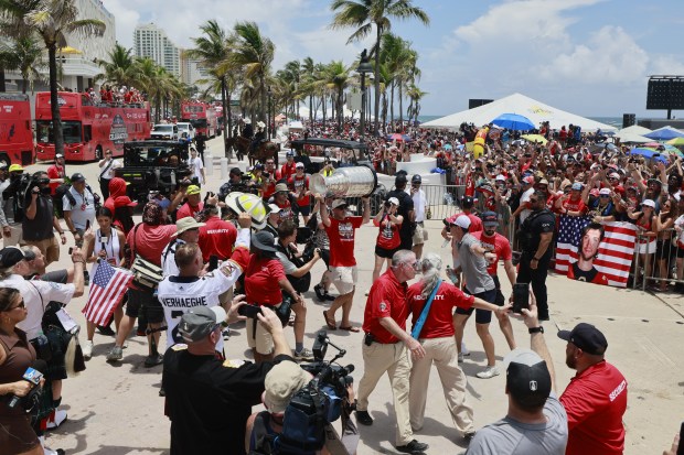 Florida Panthers’ Brad Marchand carries the Stanley Cup through the crowd during the championship parade on Fort Lauderdale beach on Sunday, June 22, 2025. (Mike Stocker/South Florida Sun Sentinel)