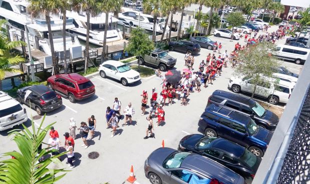 Fans wait in line to get a Water Taxi at...
