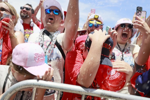 Fans celebrate in front of the rally stage during the...