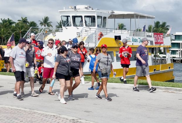Florida Panthers fans arrive from the Water Taxi to Fort...