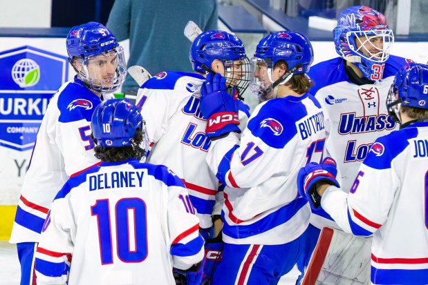 Among those celebrating a Hockey East playoff victory over New Hampshire last season were UMass Lowell teammates Chris Delaney (10) and Mirko Buttazzoni (17). (James Thomas for the Lowell Sun)
