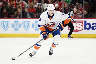 New York Islanders defenseman Noah Dobson skates with the puck during 2024 game.