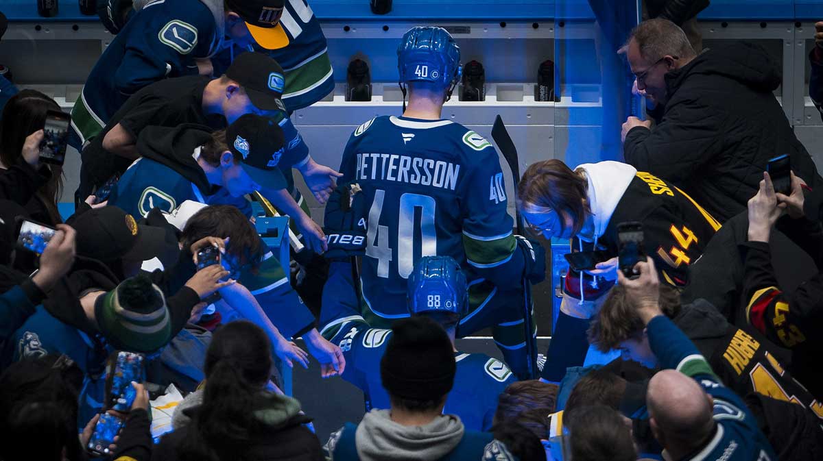 Vancouver Canucks forward Elias Pettersson (40) walks onto the bench during warm up prior to a game against the Utah Hockey Club at Rogers Arena.