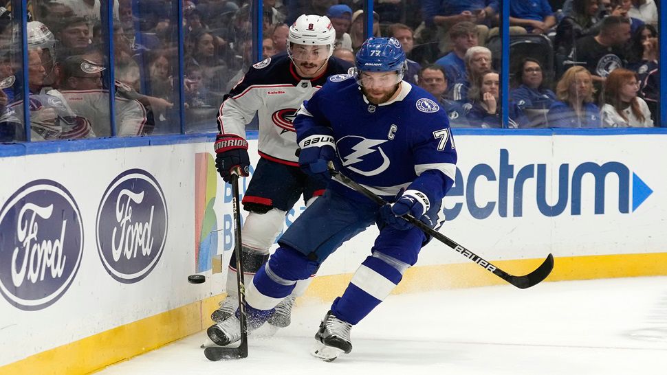 Tampa Bay defenseman Victor Hedman moves the puck ahead of Columbus Blue Jackets defenseman Zach Werenski during the first period on Tuesday night.