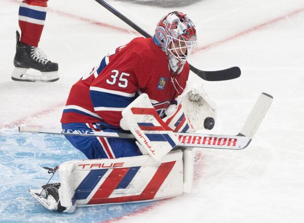 Montreal Canadiens goaltender Sam Montembeault (35) makes a save during the second period of Game 3 of a first-round NHL hockey playoff series against the Washington Capitals in Montreal, Friday, April 25, 2025. (Christinne Muschi/The Canadian Press via AP)