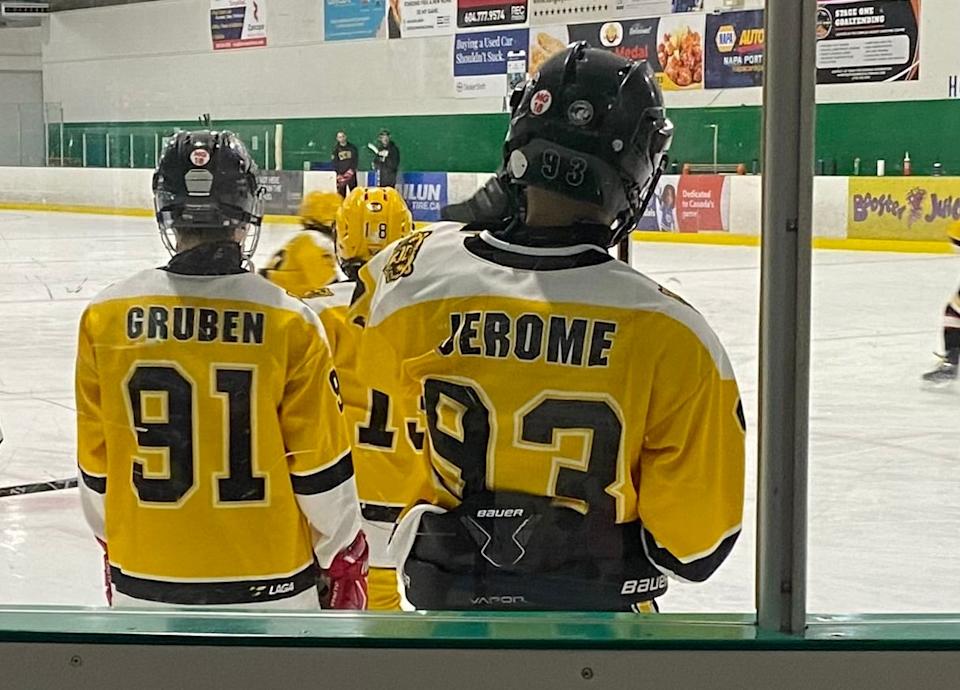 William Gruben, left, and Evander Jerome on the ice. The pair and their families moved from communities in the Mackenzie Delta to Whitehorse to give their kids a chance to play competitive hockey. 
