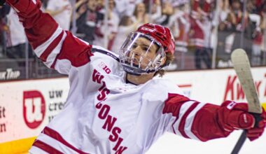 Logan Hensler skating for the University of Wisconsin