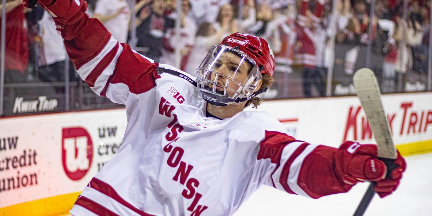Logan Hensler skating for the University of Wisconsin