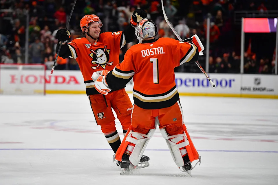 Apr 1, 2025; Anaheim, California, USA; Anaheim Ducks center Mason McTavish (23) and goaltender Lukas Dostal (1) celebrate the victory against the San Jose Sharks following the shootout period at Honda Center. Mandatory Credit: Gary A. Vasquez-Imagn Images