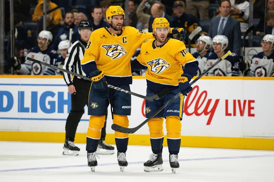 Nashville Predators center Jonathan Marchessault (81) celebrates the goal of defenseman Roman Josi (59) against the Winnipeg Jets during the first period at Bridgestone Arena.Steve Roberts-Imagn Images