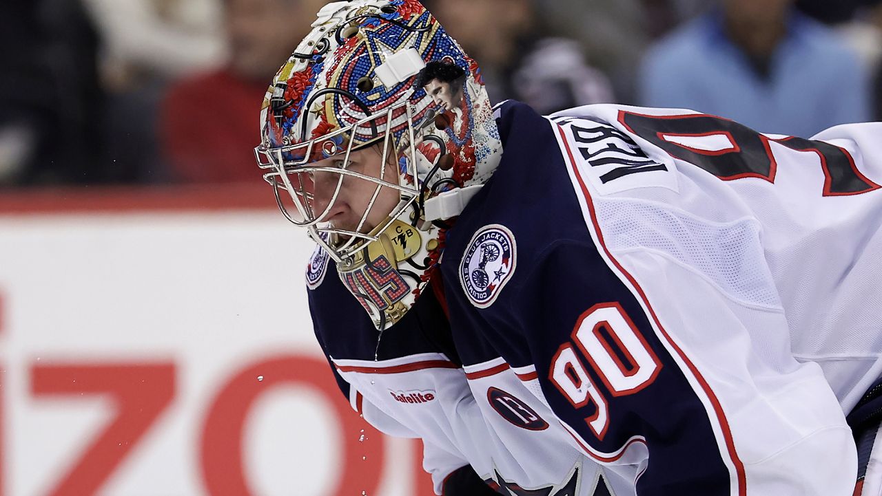 Columbus Blue Jackets goaltender Elvis Merzlikins reacts during the second period of an NHL hockey game against the New Jersey Devils Tuesday, March 11, 2025, in Newark, N.J.
