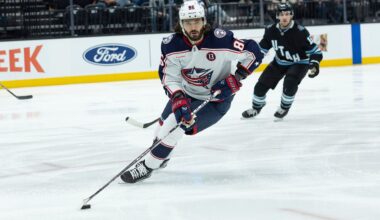 Columbus Blue Jackets right wing Kirill Marchenko (86) skates with the puck against Utah Hockey Club center Alexander Kerfoot (15) during the first period of an NHL hockey game Friday, Jan. 31, 2025, in Salt Lake City. (AP Photo/Melissa Majchrzak)