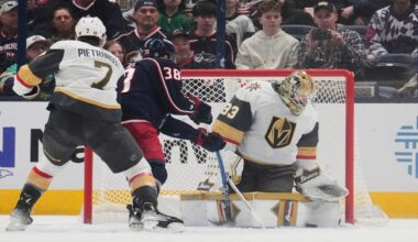 Vegas Golden Knights goaltender Adin Hill (33) blocks a shot by Columbus Blue Jackets center Boone Jenner (38) in the first period of an NHL hockey game Thursday, March 13, 2025, in Columbus, Ohio. (AP Photo/Sue Ogrocki)