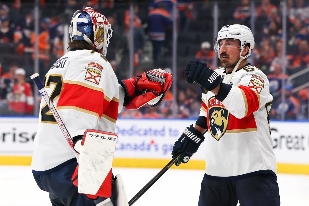 Sergei Bobrovsky and Brad Marchand of the Florida Panthers celebrate after Game 5.