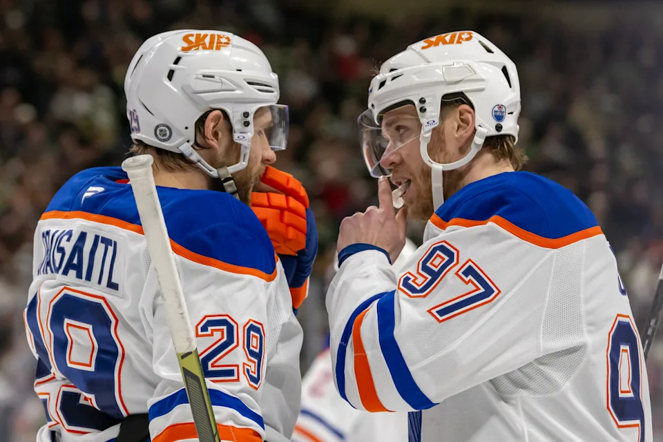 Edmonton Oilers forward Leon Draisaitl (29) and forward Connor McDavid (97) talk before a face-off.Nick Wosika-Imagn Images
