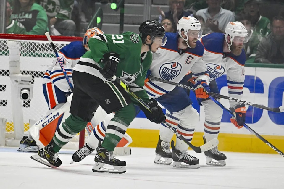 Dallas Stars left wing Jason Robertson (21) and Edmonton Oilers center Connor McDavid (97) look for the puck in the Oilers zone during the third period in game two of the Western Conference Final of t...Jerome Miron-Imagn Images