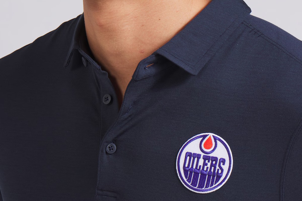 Close-up of the Edmonton Oilers embroidered logo on the Edmonton Oilers Lululemon Evolution Polo.