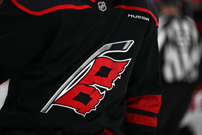 RALEIGH, NC - NOVEMBER 03: A general view of the Carolina Hurricanes jersey logo during the NHL game between the Washington Capitals and the Carolina Hurricanes on November 3, 2024 at Lenovo Center in Raleigh, North Carolina. 