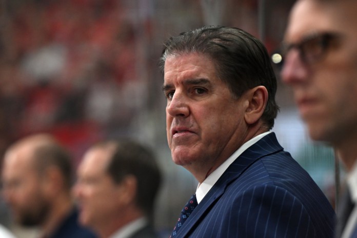 RALEIGH, NC - NOVEMBER 27: New York Rangers head coach Peter Laviolette watches the play during the NHL game between the New York Rangers and the Carolina Hurricanes on November 27, 2024 at Lenovo Center in Raleigh, North Carolina.