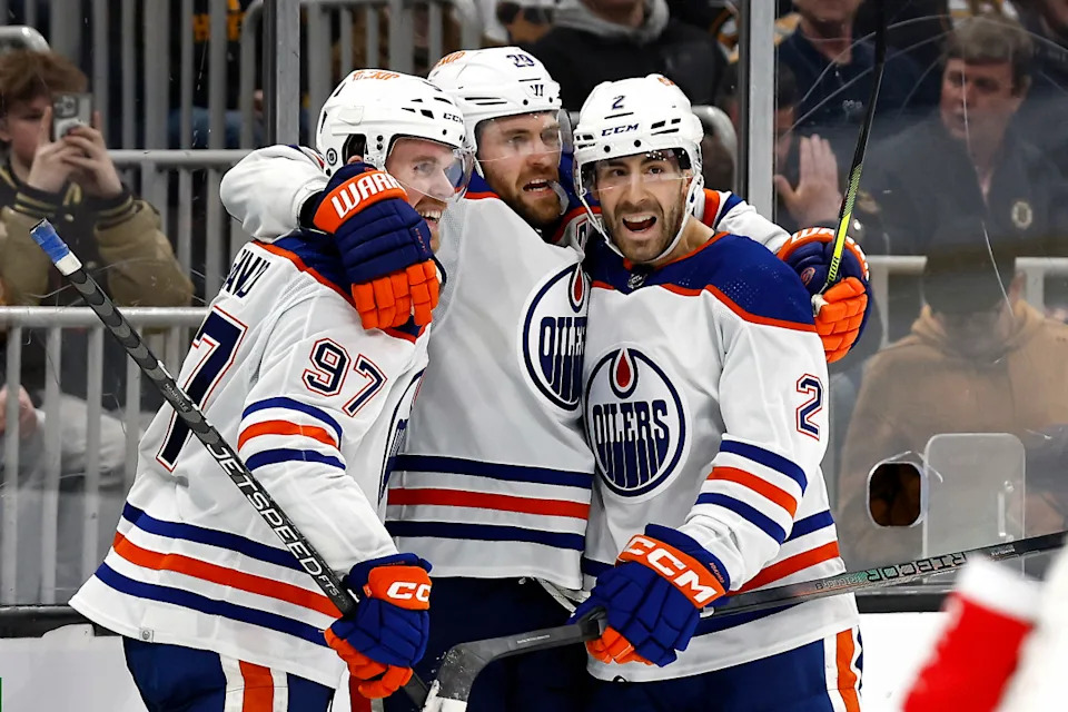 The Oilers' Leon Draisaitl, center, celebrates a game-winning goal with teammates Connor McDavid (97) and Evan Bouchard.Winslow Townson-Imagn Images