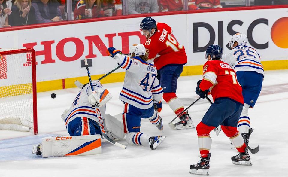 Florida Panthers left wing Matthew Tkachuk (19) fires a shot past Edmonton Oilers goaltender Stuart Skinner (74) to score during the first period of Game 4 in the NHL Stanley Cup Final at Amerant Bank Arena on Thursday, June 12, 2025, in Sunrise, Fla.