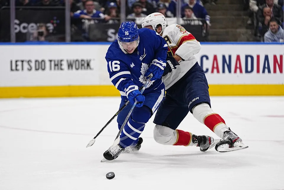 Toronto Maple Leafs forward Mitchell Marner (16) fights for the puck during a Stanley Cup Playoffs game.John E&period; Sokolowski-Imagn Images