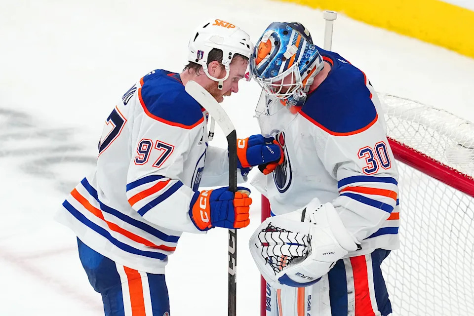 Edmonton Oilers center Connor McDavid (97) congratulates goaltender Calvin Pickard (30) after defeating the Vegas Golden Knights 4-2 at T-Mobile Arena.Stephen R. Sylvanie-Imagn Images