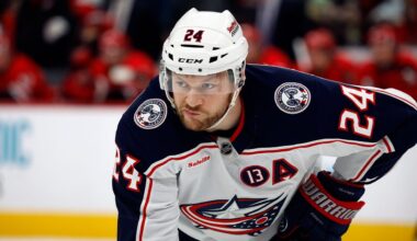Columbus Blue Jackets' Mathieu Olivier (24) waits for a face-off against the Carolina Hurricanes during the first period of an NHL hockey game in Raleigh, N.C., Thursday, Jan. 23, 2025.