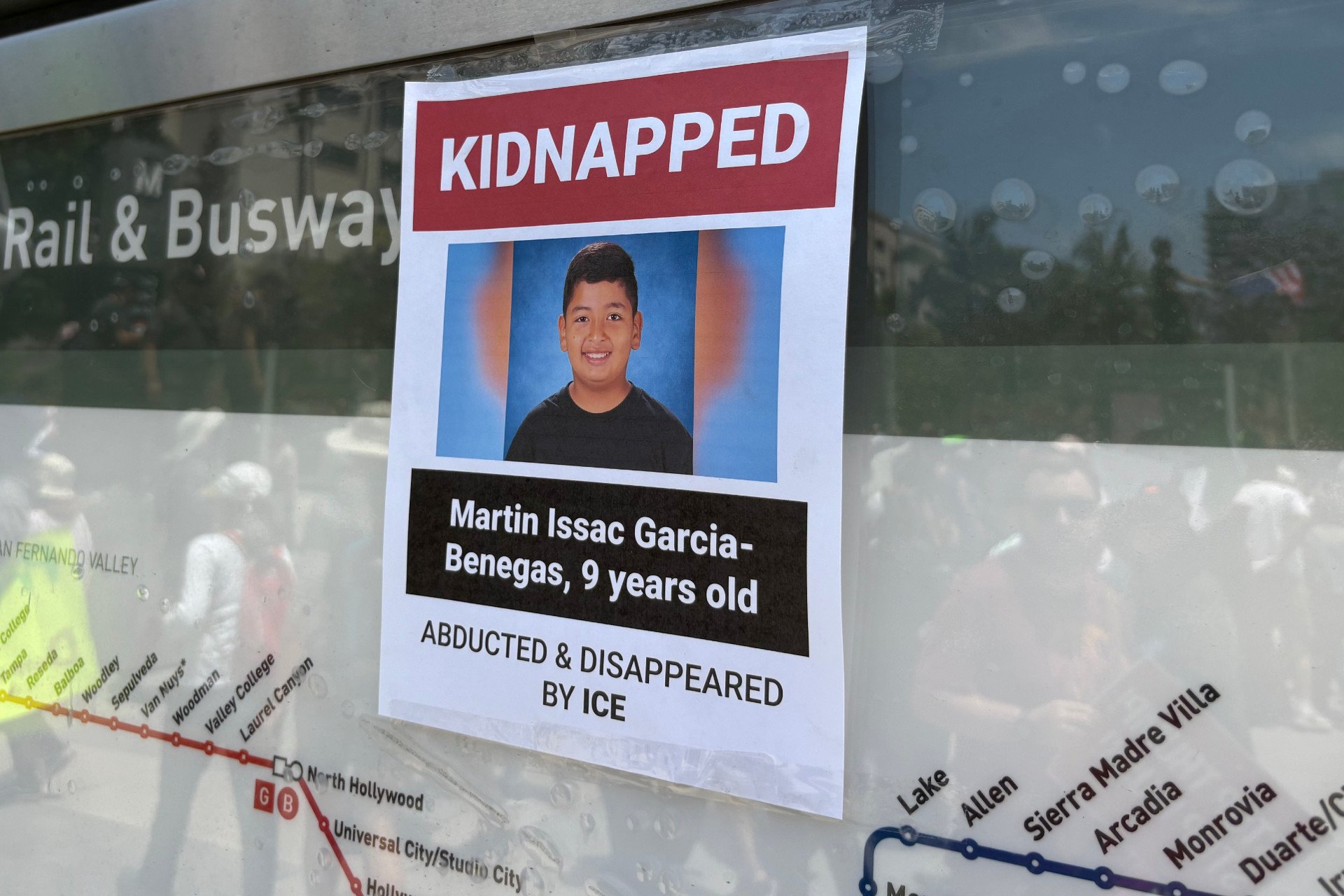Poster placed on a transit sign about the abduction of 9-year-old Marti Issac Garcia by federal agents, photographed in Los Angeles during the No Kings protest on June 14, 2025.