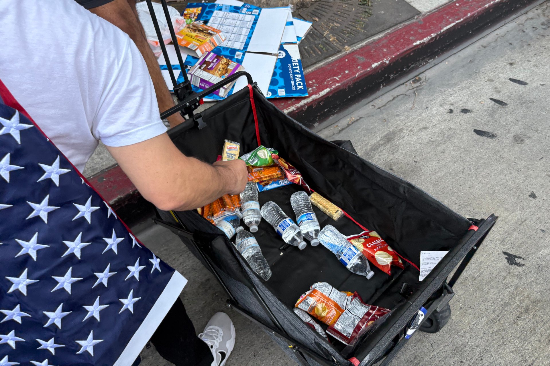 Someone offers snacks and water to strangers at the protests in downtown Los Angeles on June 14, 2025.