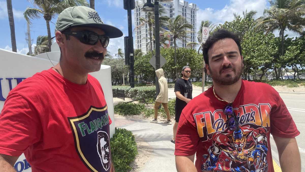 Florida Panthers fans celebrating while waiting for championship parade