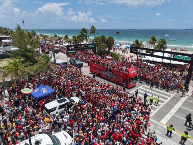 Fans celebrate during the Panthers championship parade on Fort Lauderdale...