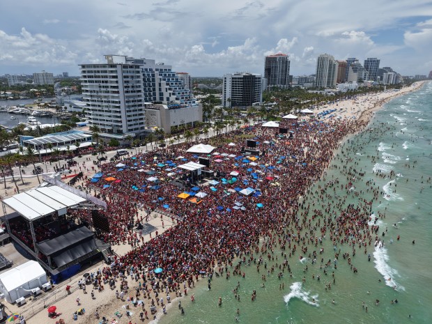 Fans celebrate during the Panthers championship parade on Fort Lauderdale Beach, Sunday, June 22, 2025. (Sean Pitts/South Florida Sun Sentinel)