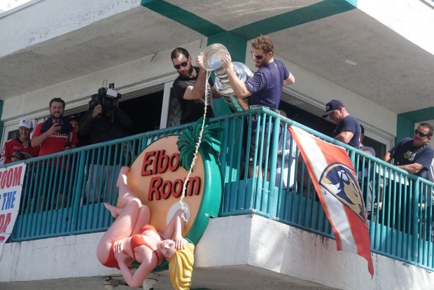 Florida Panthers Anthony Stolarz and Matthew Tkachuk pour beer from...