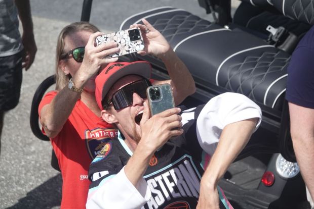 Fans take photos as the Florida Panthers celebrate winning the...