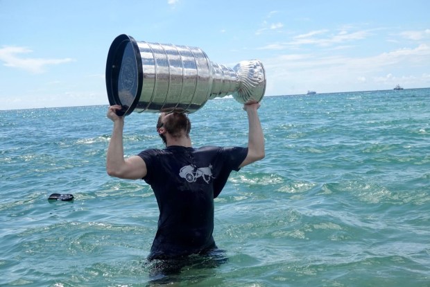 Florida Panthers Matthew Tkachuk celebrates winning the the Stanley Cup in the Atlantic Ocean near Elbo Room in Fort Lauderdale on Tuesday, June 25, 2024. (Joe Cavaretta/South Florida Sun Sentinel)