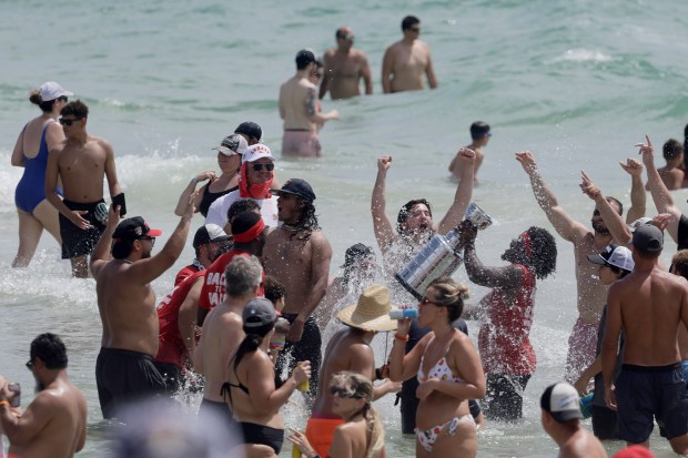 Fans celebrate at Fort Lauderdale beach as the Florida Panthers’...