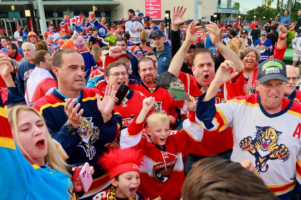 Florida Panthers fans cheer for their team before they go...