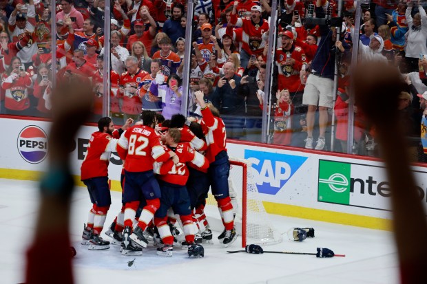 The Florida Panthers celebrate as they win Game 7 of...