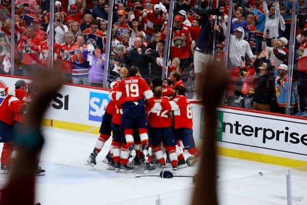The Florida Panthers celebrate as they win Game 7 of...