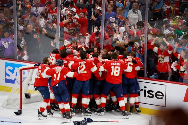 The Florida Panthers celebrate as they win Game 7 of...