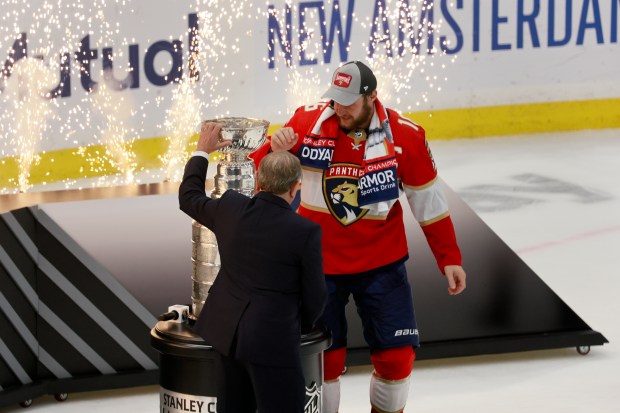 Florida Panthers center Aleksander Barkov (16) is presented with the...