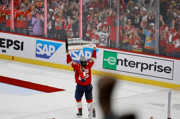 Florida Panthers center Aleksander Barkov (16) hoists the Stanley Cup...